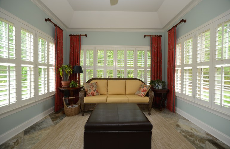 Sunroom with white plantation shutters